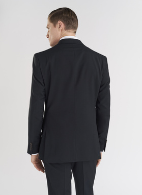 Vilnonės žalios kostiuminės kelnės