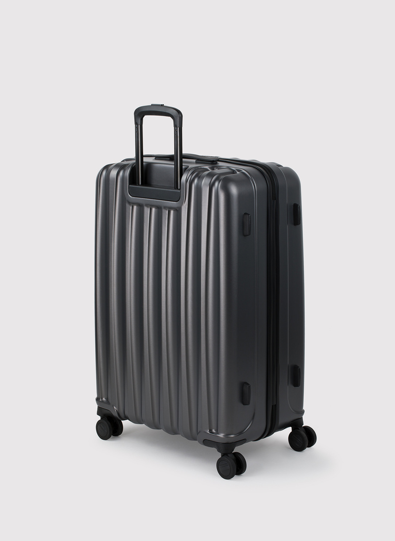 Didelis tamsiai pilkas lagaminas su grioveliais