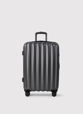 Vidutinis tamsiai pilkas lagaminas su grioveliais