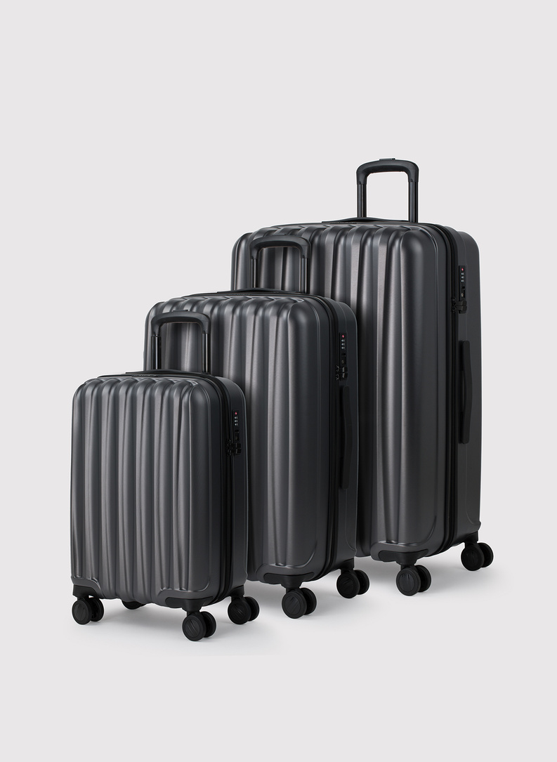 Mažas tamsiai pilkas lagaminas su grioveliais