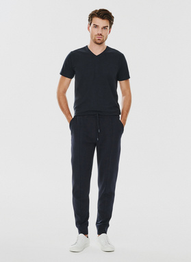 Tamsiai mėlynos spalvos treninginės kelnės