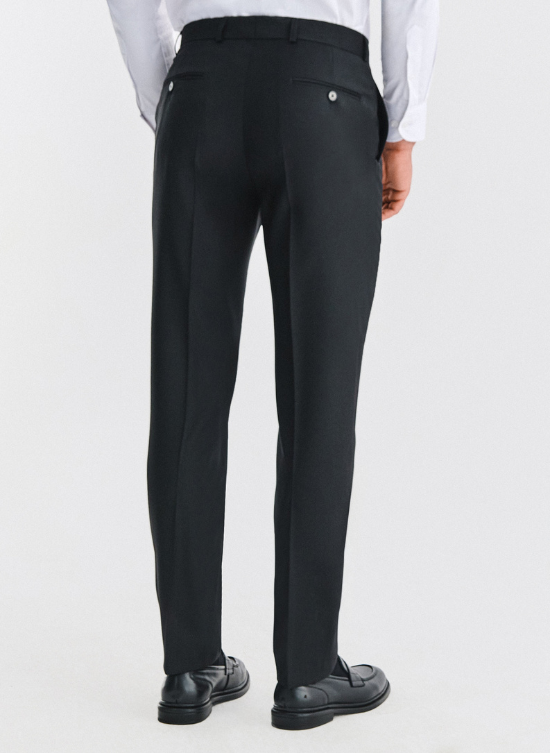 Vilnonės juodos kostiuminės kelnės