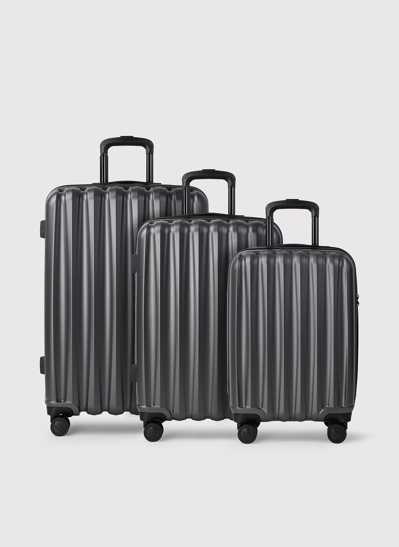 Mažas tamsiai pilkas lagaminas su grioveliais