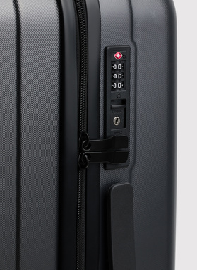 Vidutinis tamsiai pilkas lagaminas su grioveliais