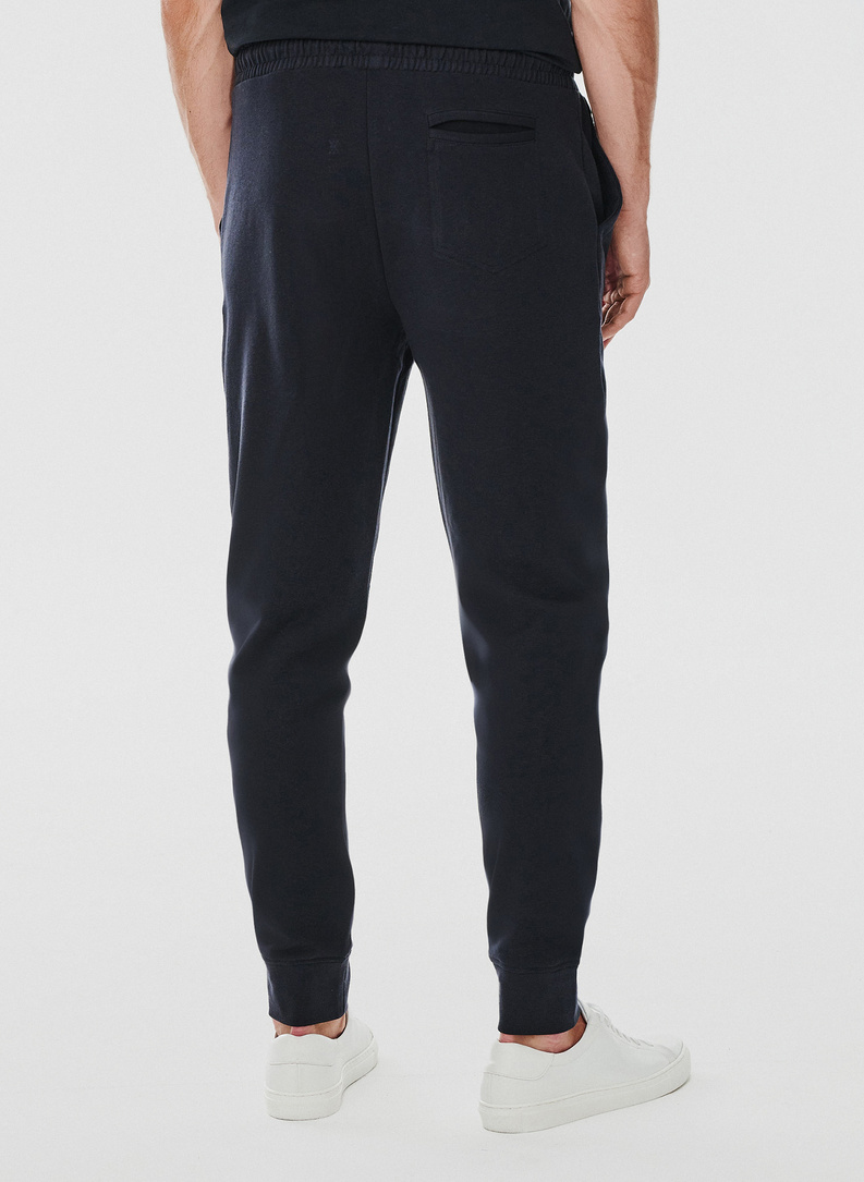 Tamsiai mėlynos spalvos treninginės kelnės