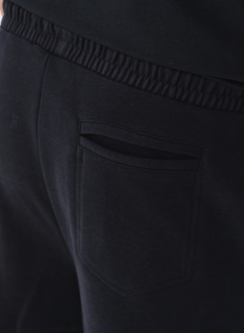 Tamsiai mėlynos spalvos treninginės kelnės