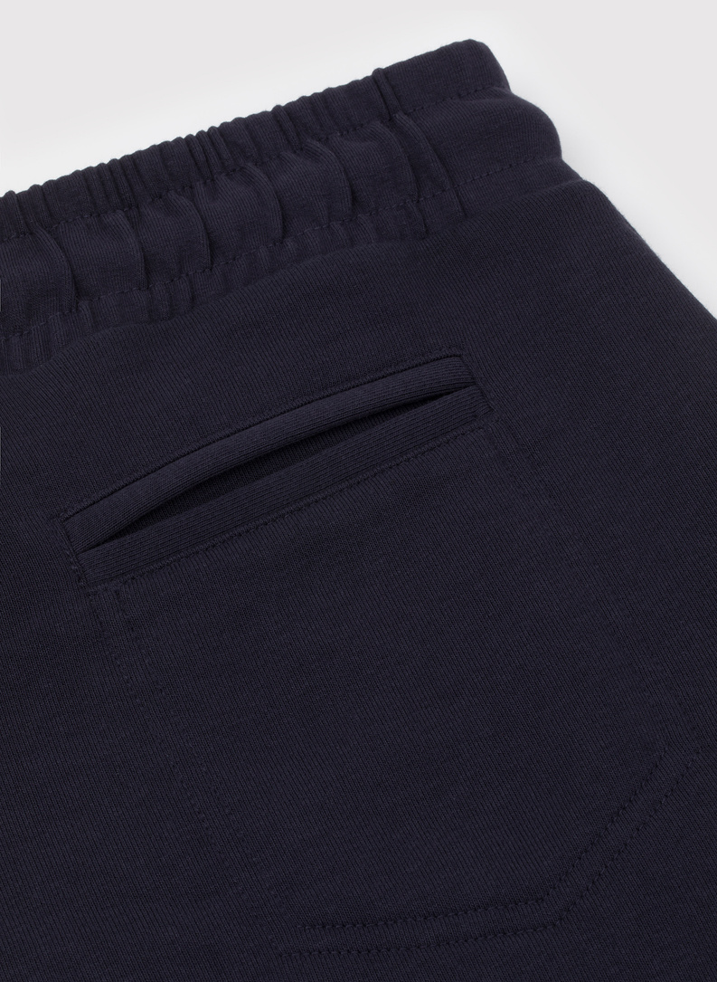 Tamsiai mėlynos treninginės kelnės