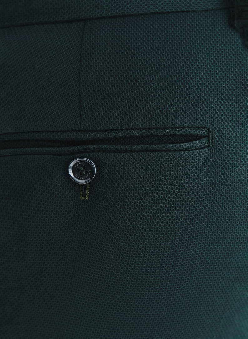 Žalios kostiuminės kelnės